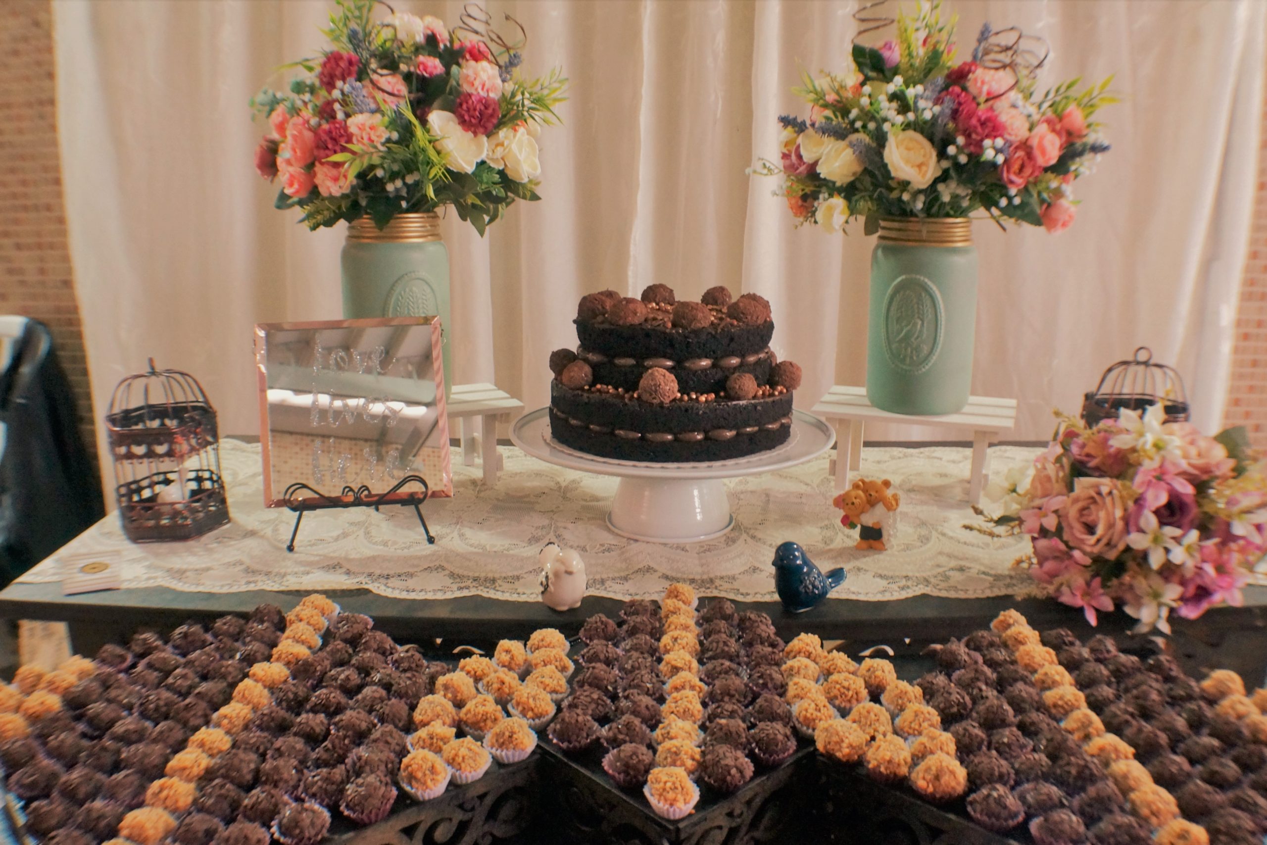 wedding dessert table with brigadeiros and cake